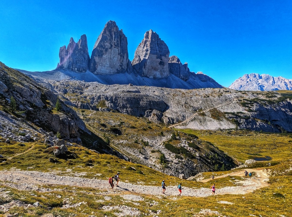 running in front of tre cime
