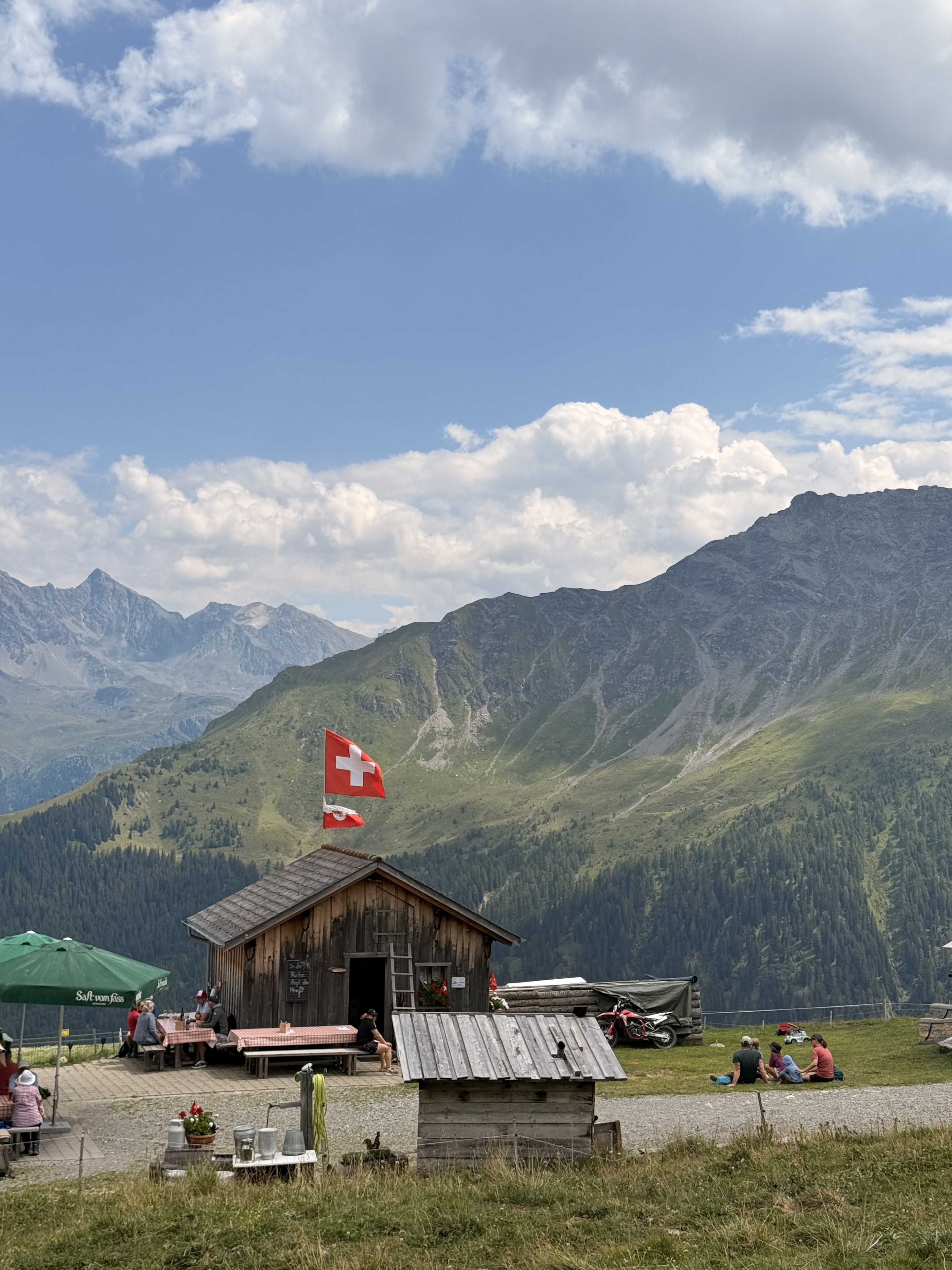 Stone hut with a Swiss flag